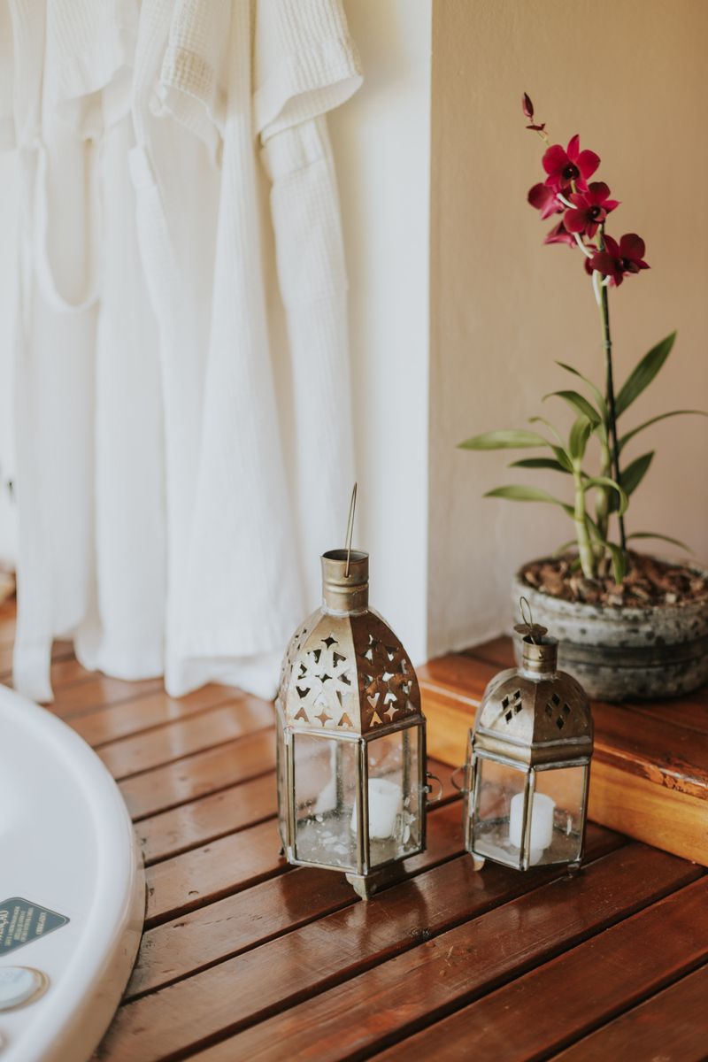 Spa candles, orchids and folded towels